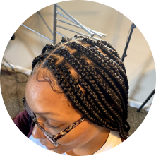 a picture of a woman with box braids