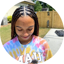 a picture of a girl with knotless braids